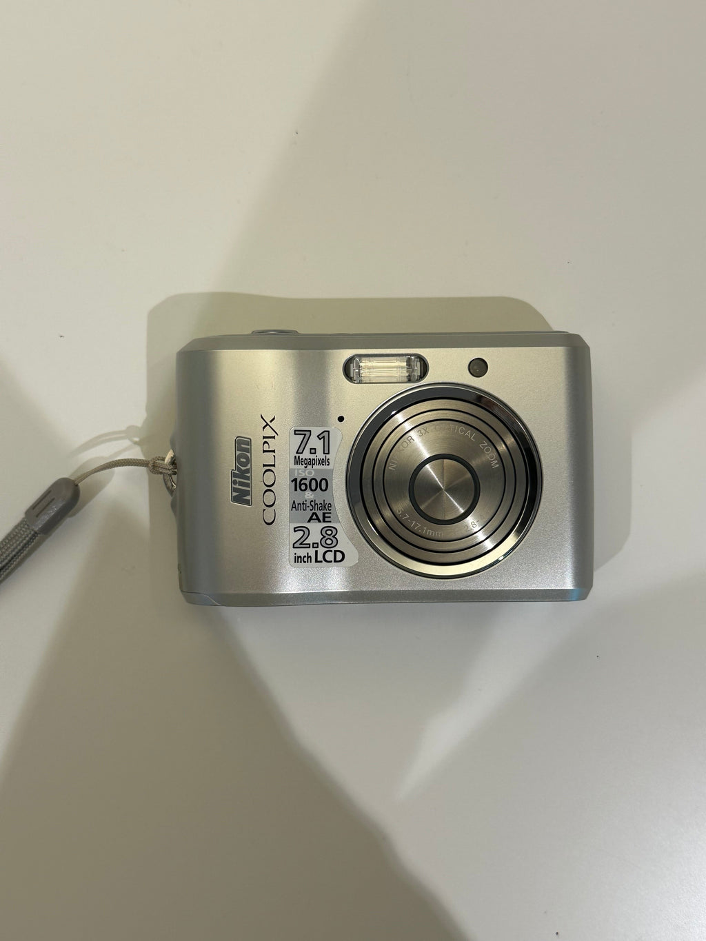 Silver Nikon Coolpix L16 digital camera