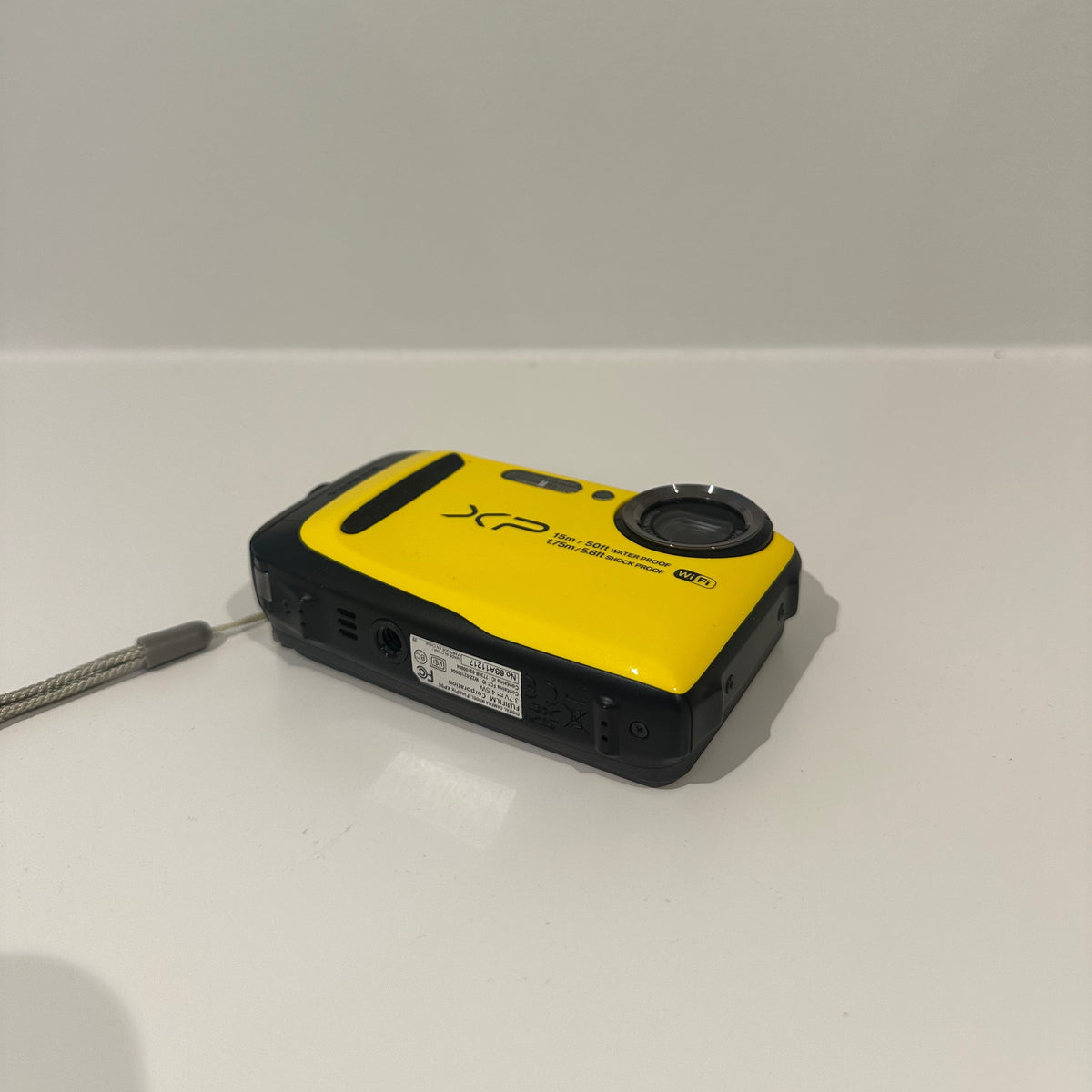 Yellow Fujifilm FinePix XP90 digital camera